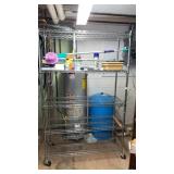 Metal rolling rack on wheels. Approximately 76 x