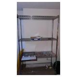 Metal rolling rack on wheels. . Approximately  76