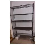Metal rolling rack on wheels. .  Approximately