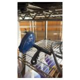 Shelf of drain snake rope, gas line and