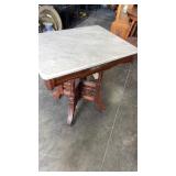 Granite top and wood base side table on casters