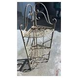 Wrought iron corner shelf with distressed finish,