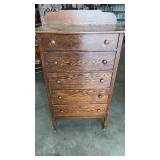 Wooden 5 drawer dresser  on wheels approximately