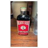 3 vintage glass bottles one black slick stove