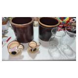 2 brown crocks. Set of 2 rooster measuring cups