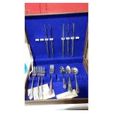 Miscellaneous lot of silverware in a wooden box