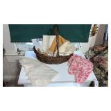 Basket with crocheted doilies and table runners