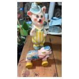 Chalkware pig figure and pig pull toy