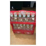 Wooden spice rack with glass bottles