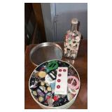 Tin and bottle of miscellaneous buttons
