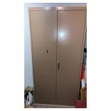 Metal 2 door cabinet in basement buyer must move