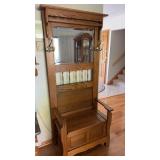 Wooden hall tree with a mirror and bench