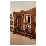 Wall mirror with trinkets and decoration