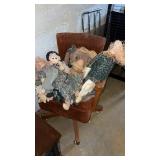 Swivel chair and dolls in basement