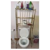 Above the toilet rack and contents