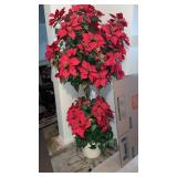 Faux poinsettia tree  Approximately  75" tall  in