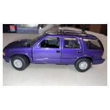 Red box 1994 GMC Jimmy diecast car 1/24 scale