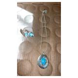 Womanï¿½s silver tone clip earring, and necklace