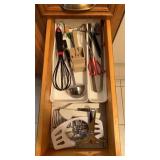 Grouping of kitchen utensils including apple