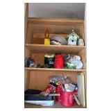 Cupboard of outdoor items, paint rollers and