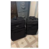 2 suit cases on wheels very clean