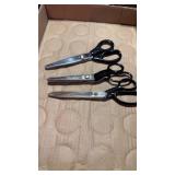 One pair of scissors and two shears