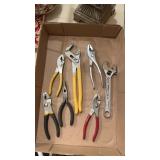 Grouping of Pliers and a Wrench