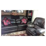 Brown leather couch and chair with throw pillows