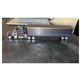 Diecast Semi truck and trailer. The word pride