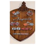 Wood plaque with Chevy emblems