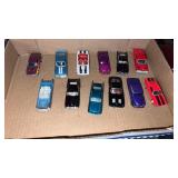 12 miscellaneous  diecast cars . 1:64 scale