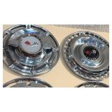 2 Chevy hubcaps