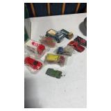Vintage toy trucks and cars, some sealed and