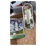 1 ceramic thermometer and 1 cat thermometer