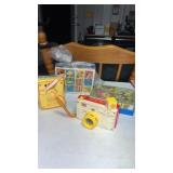 Fisher-Price story camera , pocket radio, and