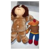 Cabbage, patch animal, and Ernie dolls. Ernie has
