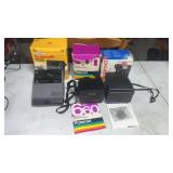 2 polaroid cameras in original boxes box has some