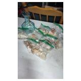 Large grouping of seashells and a blue vase. Blue