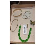 Gold tone bracelets and butterfly pin