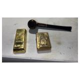 Brass, zippo lighters, and a pipe