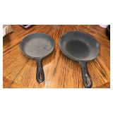 2 small cast iron pans 3 and 5D marked on bottom