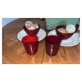 2 plates/platters , 2 red bowls , 2 red cups and