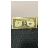 1957 silver certificate $1 bill in plastic sleeve
