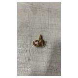 Gold tone suit pin