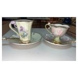 2 teacups with matching saucers and spoons