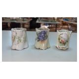 3 porcelain toothpick holders with floral design.