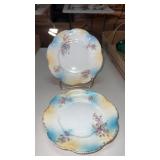 2 matching porcelain tea cup plates