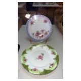 2 porcelain tea cup plates with floral design