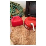 2 gas cans one metal one plastic