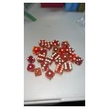 Red casino dice.  They have  lots of wear and